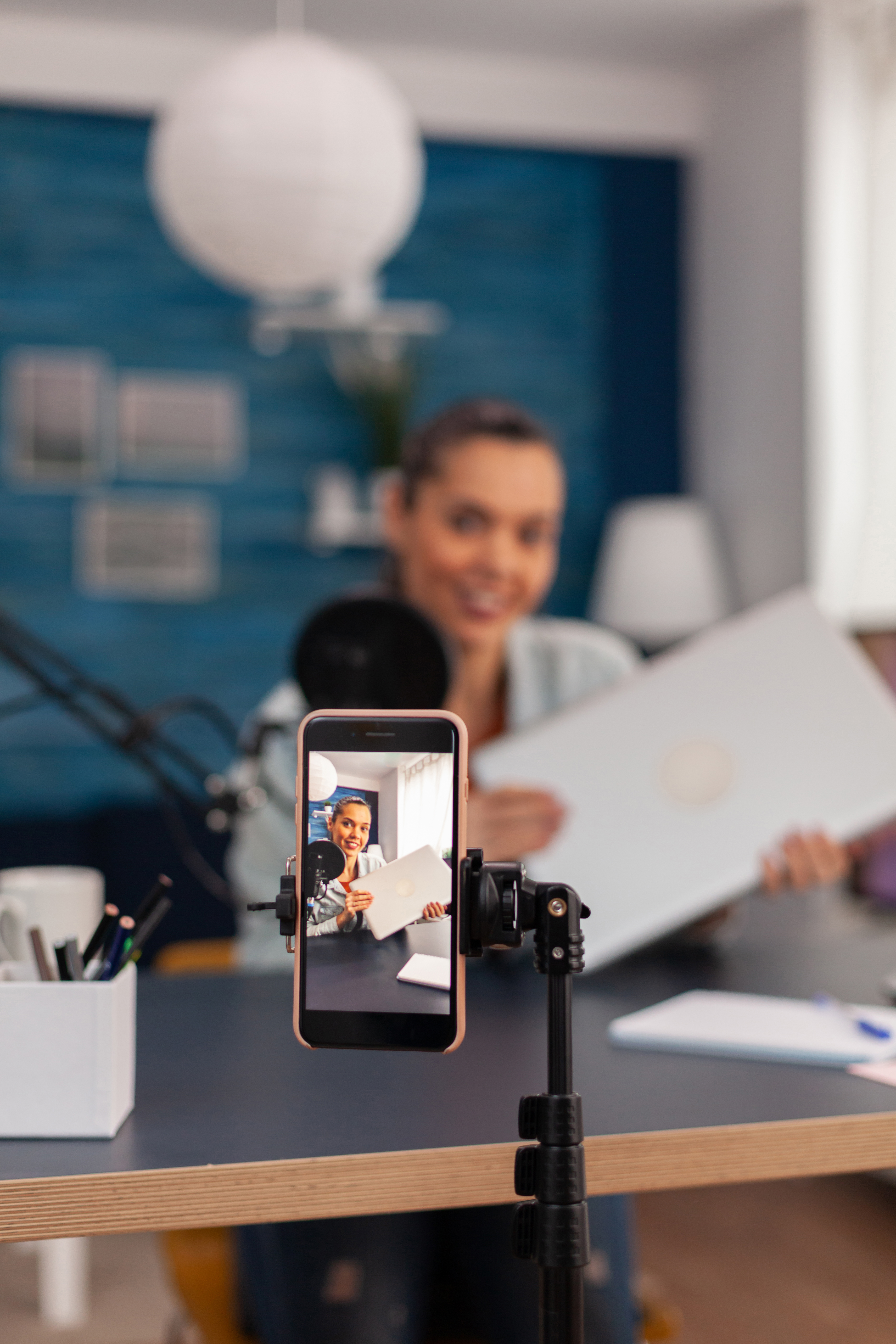 Closeup of smartphone recording product review.